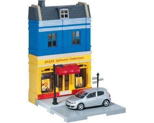 Ensemble avec façade de magasin et VOLKSWAGEN Golf GTI grise - HER800020