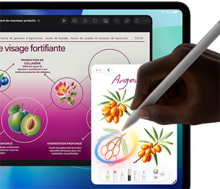 iPad Pro, écran face avant avec fond dégradé bleu foncé et vert et plusieurs apps ouvertes, main tenant un Apple Pencil Pro encerclant un croquis et illustrant la fonctionnalité baguette graphique d’Apple Intelligence