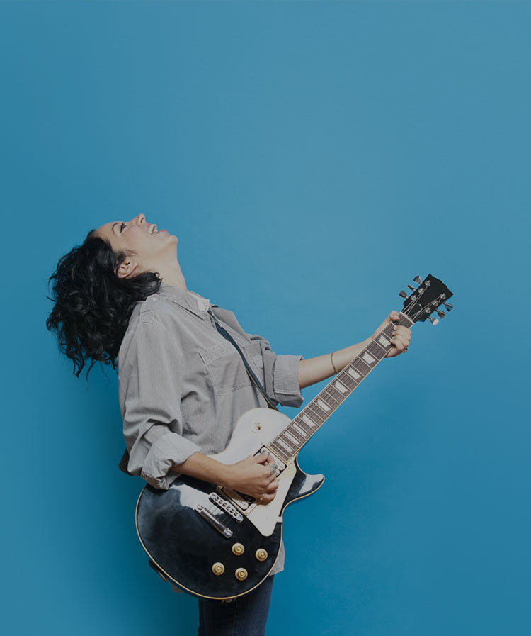 woman playing guitar